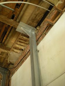 Tying the Framptons' wall back to new structural columns