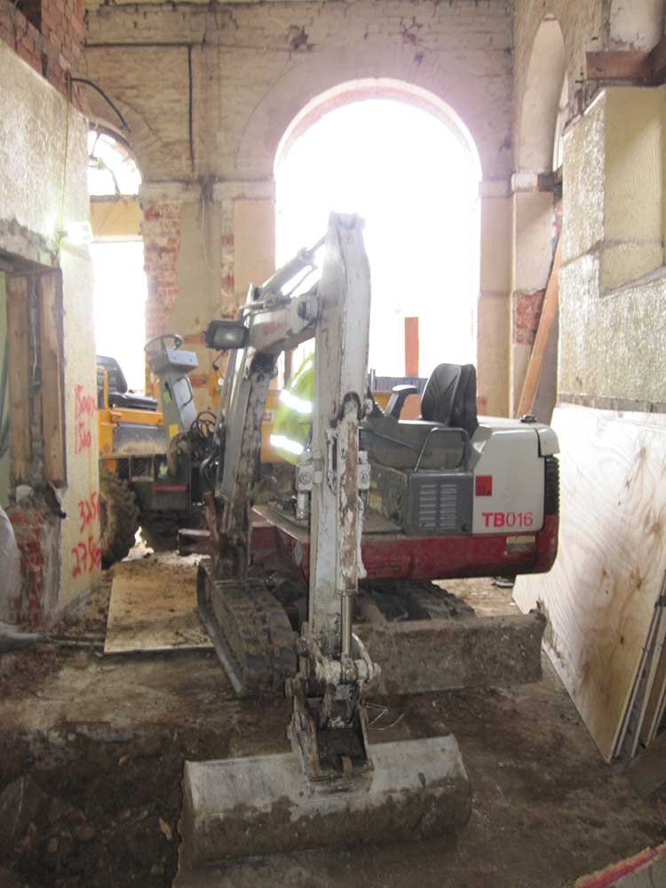 Mini diggers move into the Town Hall to excavate the ground floor